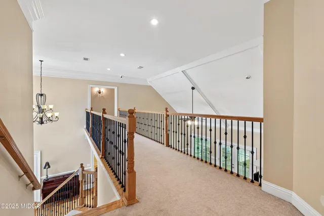 a large white bathroom with a large mirror vanity and shower
