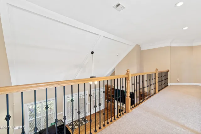 a large bathroom with a tub a double vanity sink a window and a mirror