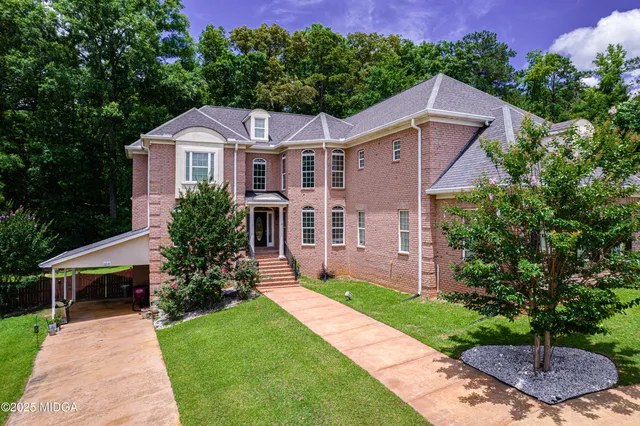a view of a brick house with a large window