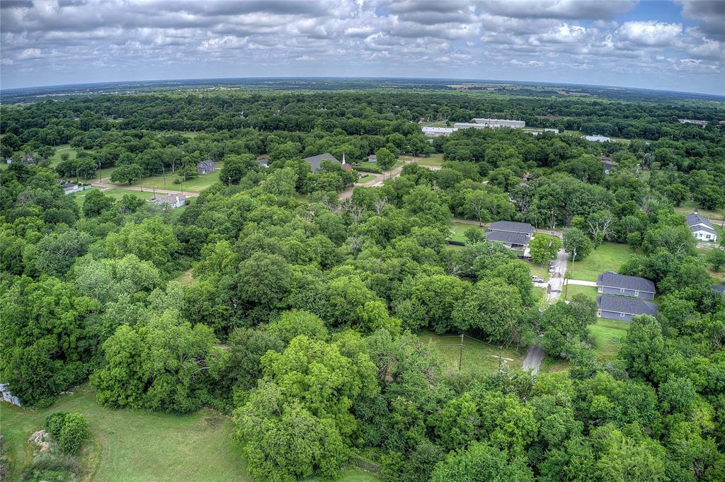 0 Sycamore Street Commerce, TX 75428 - Photo 3 of 14 an aerial view of a house with a yard