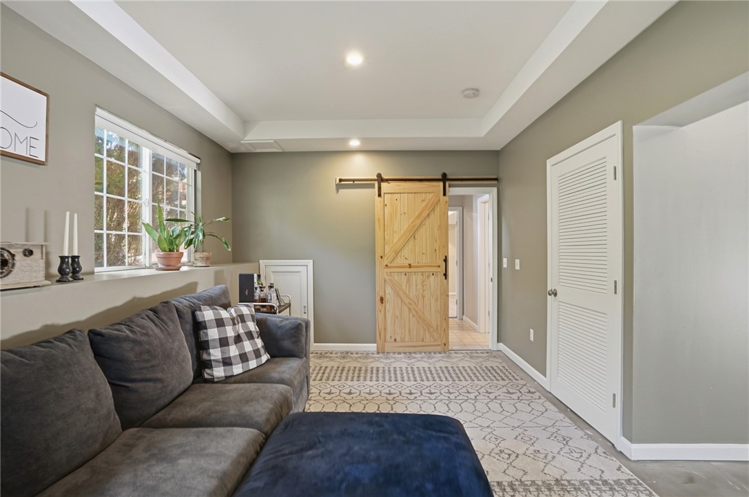 26 King Street Coventry, RI 02816 - Photo 45 of 50 Family room with barn door for privacy