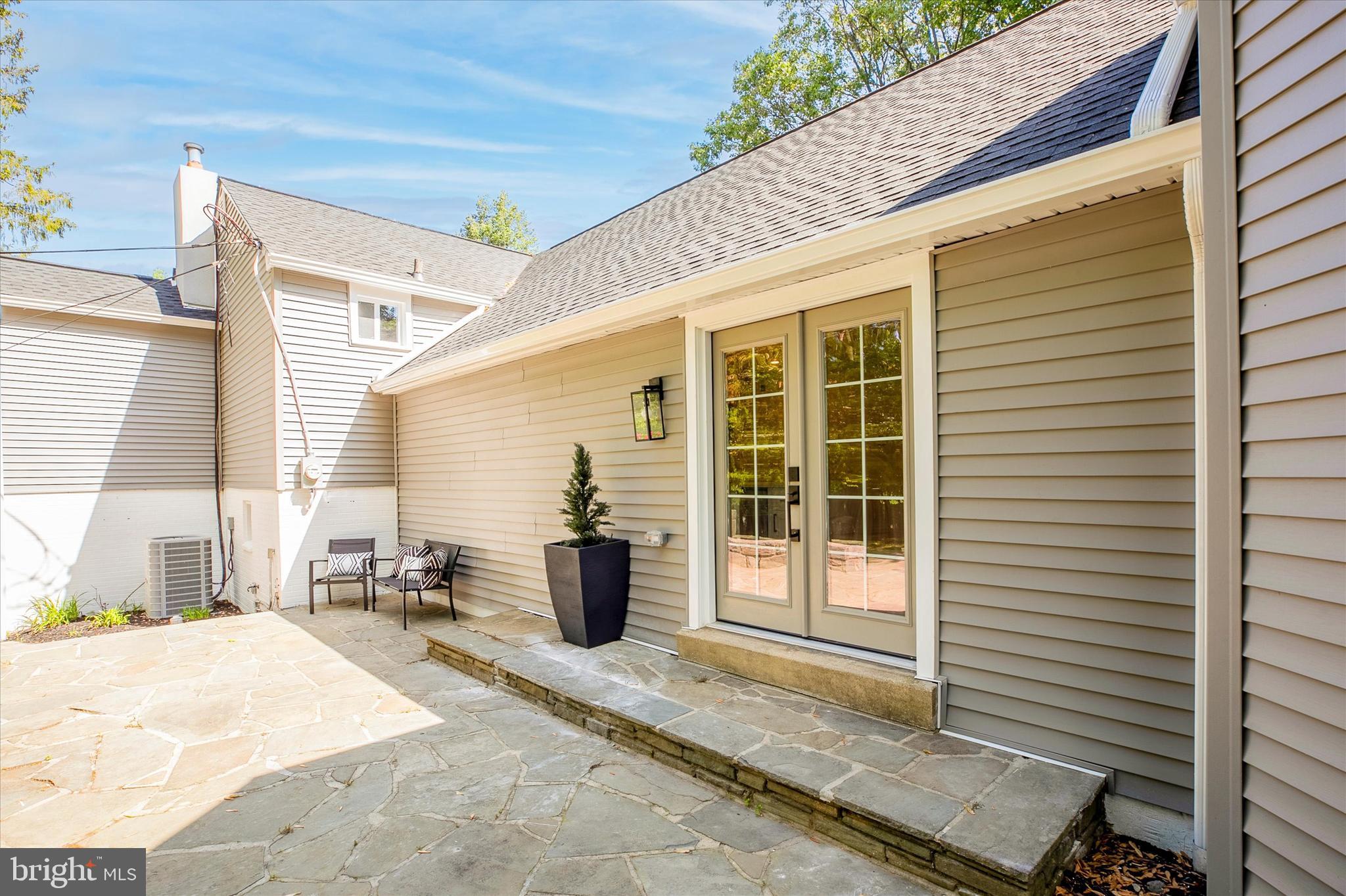 1110 West Valley Road Wayne, PA 19087 - Photo 72 of 91 French Doors off Kitchen to Stone Patio