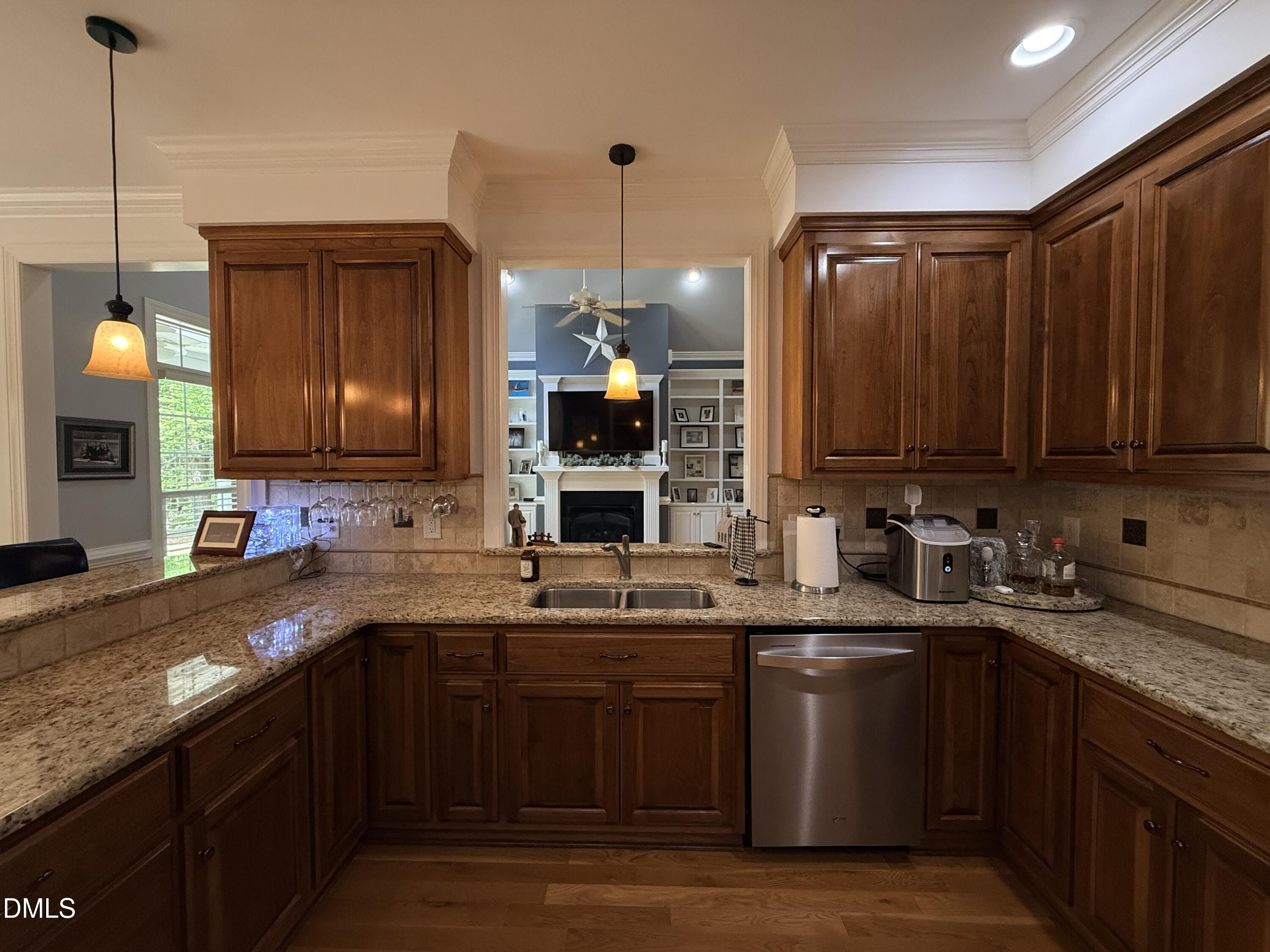 217 Clearwater Drive Roxboro, NC 27574 - Photo 23 of 57 a kitchen with stainless steel appliances granite countertop a sink a stove and cabinets