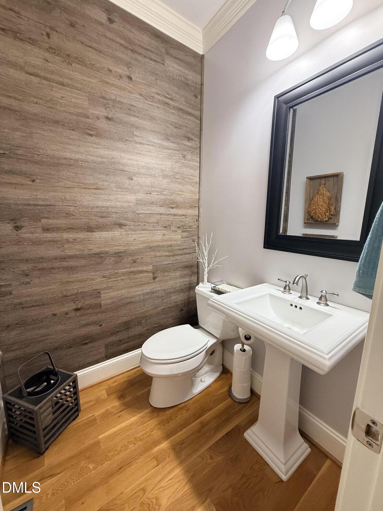 217 Clearwater Drive Roxboro, NC 27574 - Photo 25 of 57 a bathroom with a toilet sink and mirror