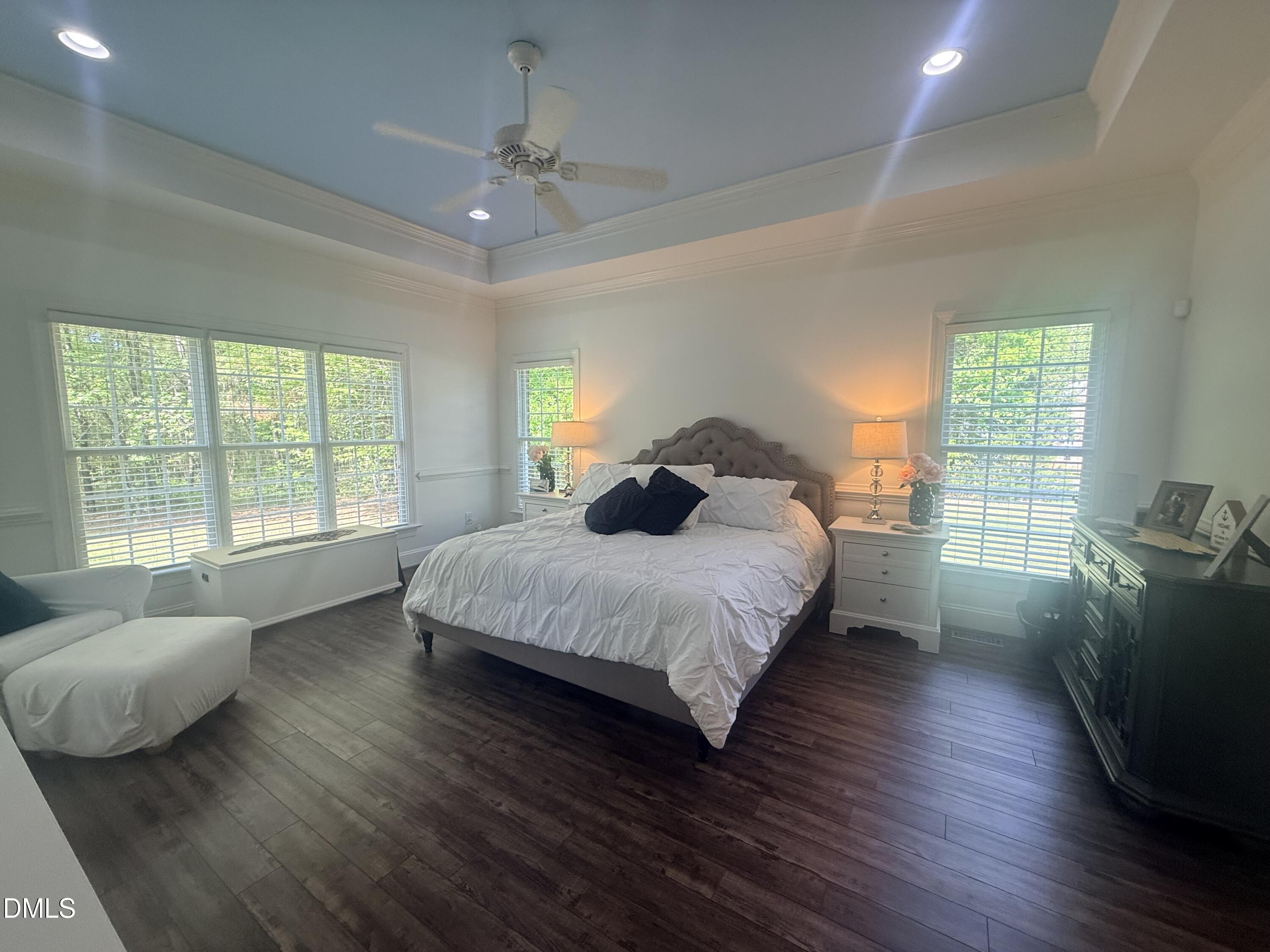 217 Clearwater Drive Roxboro, NC 27574 - Photo 27 of 57 a spacious bedroom with a bed and wooden floor