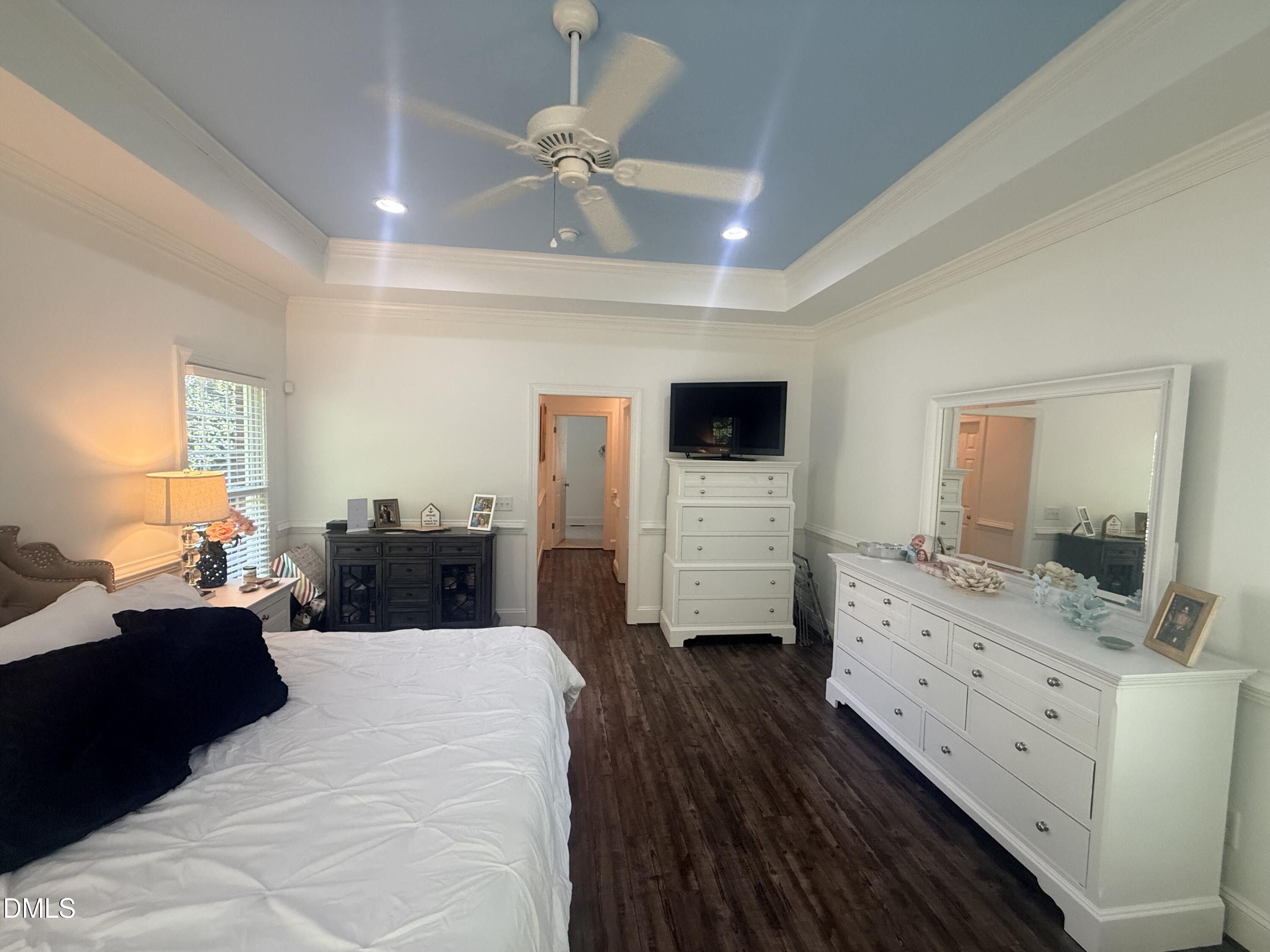 217 Clearwater Drive Roxboro, NC 27574 - Photo 29 of 57 a large bedroom with a bed and wooden floor