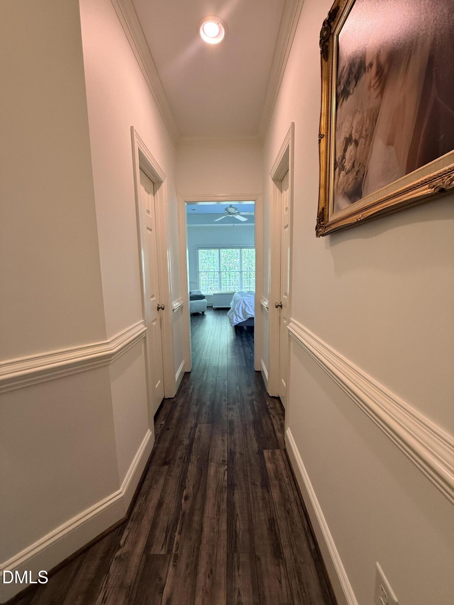 217 Clearwater Drive Roxboro, NC 27574 - Photo 31 of 57 a view of a hallway with wooden floor and staircase