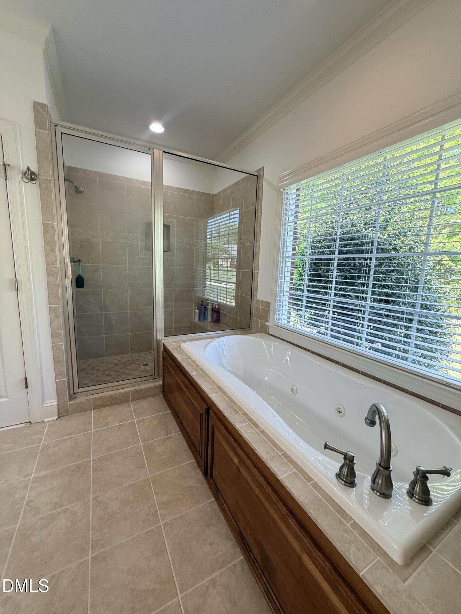 217 Clearwater Drive Roxboro, NC 27574 - Photo 34 of 57 a bathroom with a tub a sink and shower