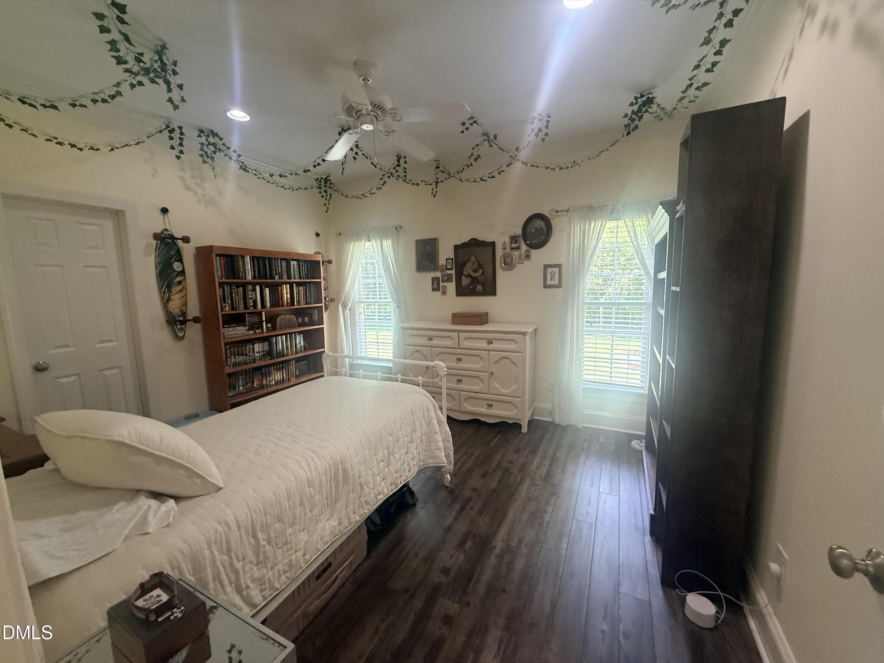 217 Clearwater Drive Roxboro, NC 27574 - Photo 37 of 57 a bedroom with a bed and a flat tv screen