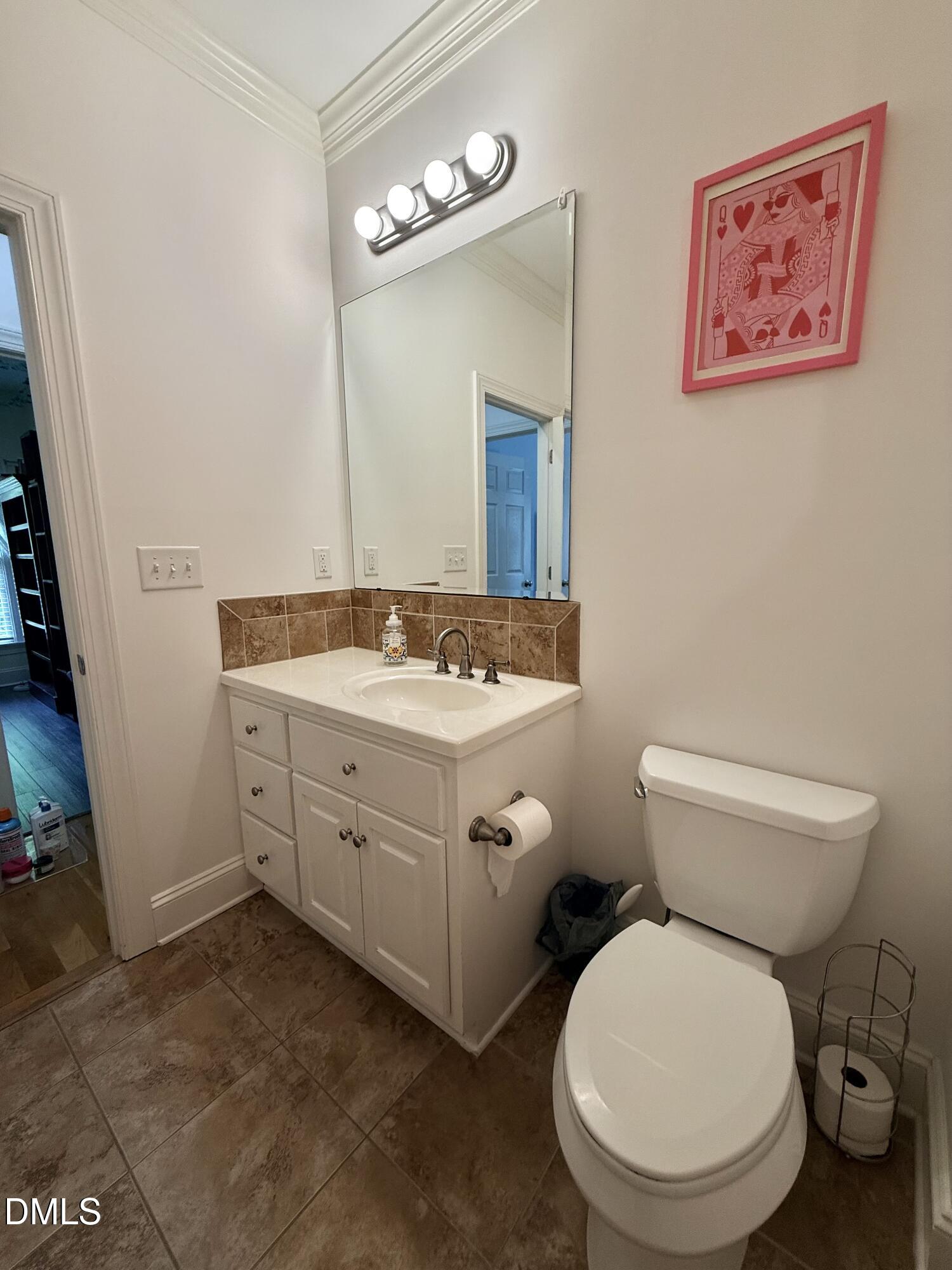 217 Clearwater Drive Roxboro, NC 27574 - Photo 41 of 57 a bathroom with a toilet sink and mirror