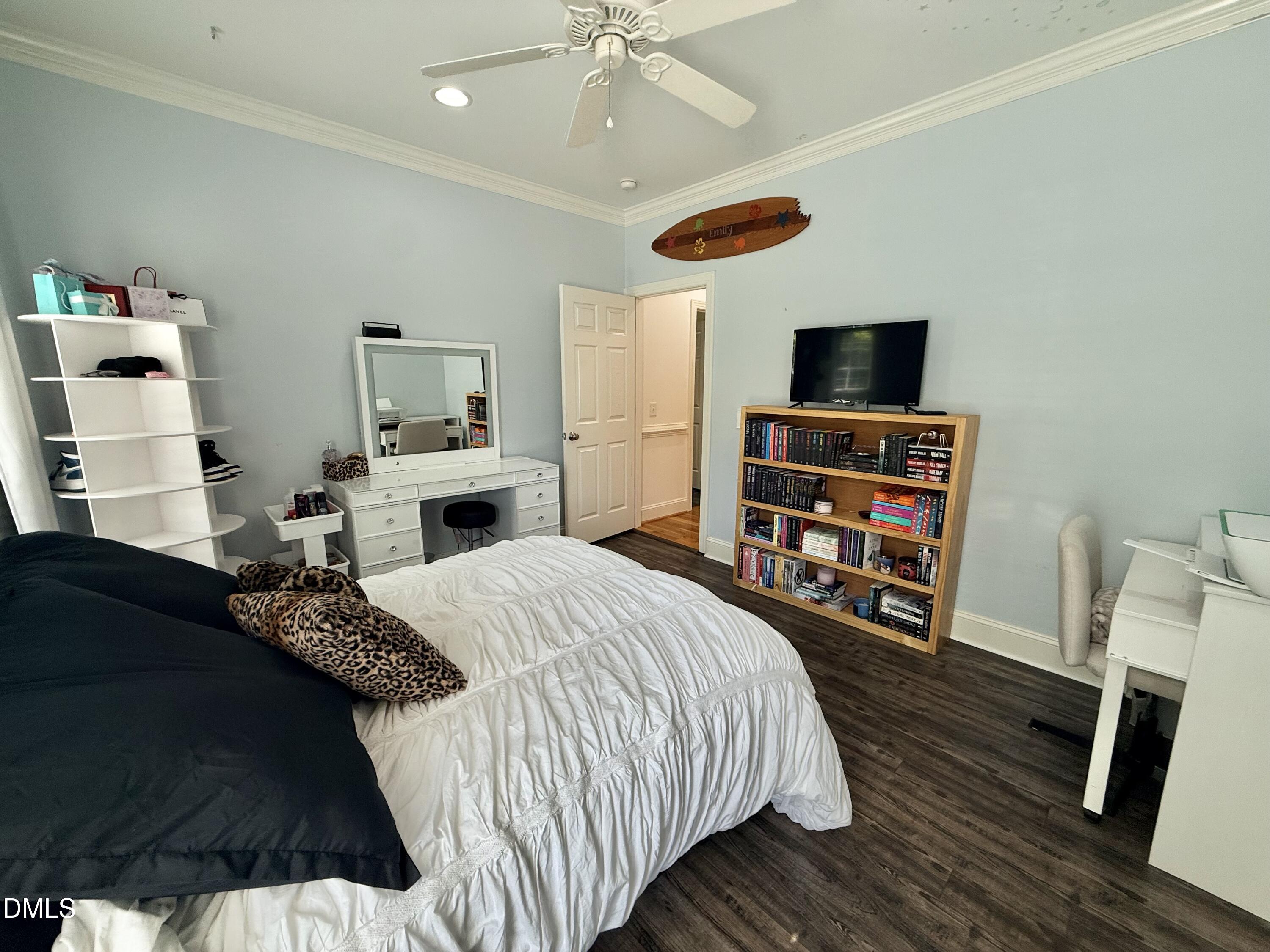 217 Clearwater Drive Roxboro, NC 27574 - Photo 42 of 57 a bedroom with a bed and a flat screen tv