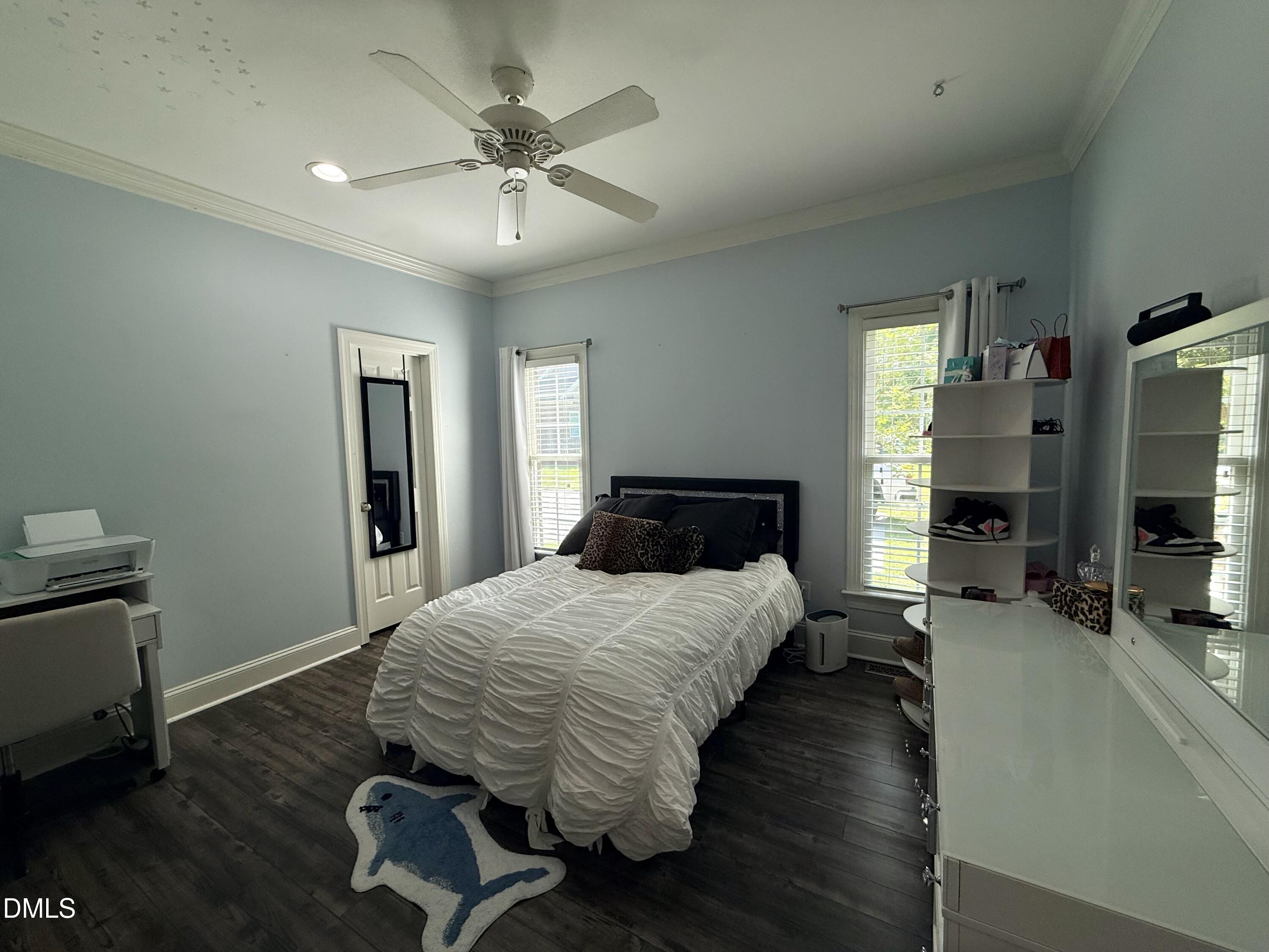 217 Clearwater Drive Roxboro, NC 27574 - Photo 44 of 57 a bedroom with a bed and wooden floor
