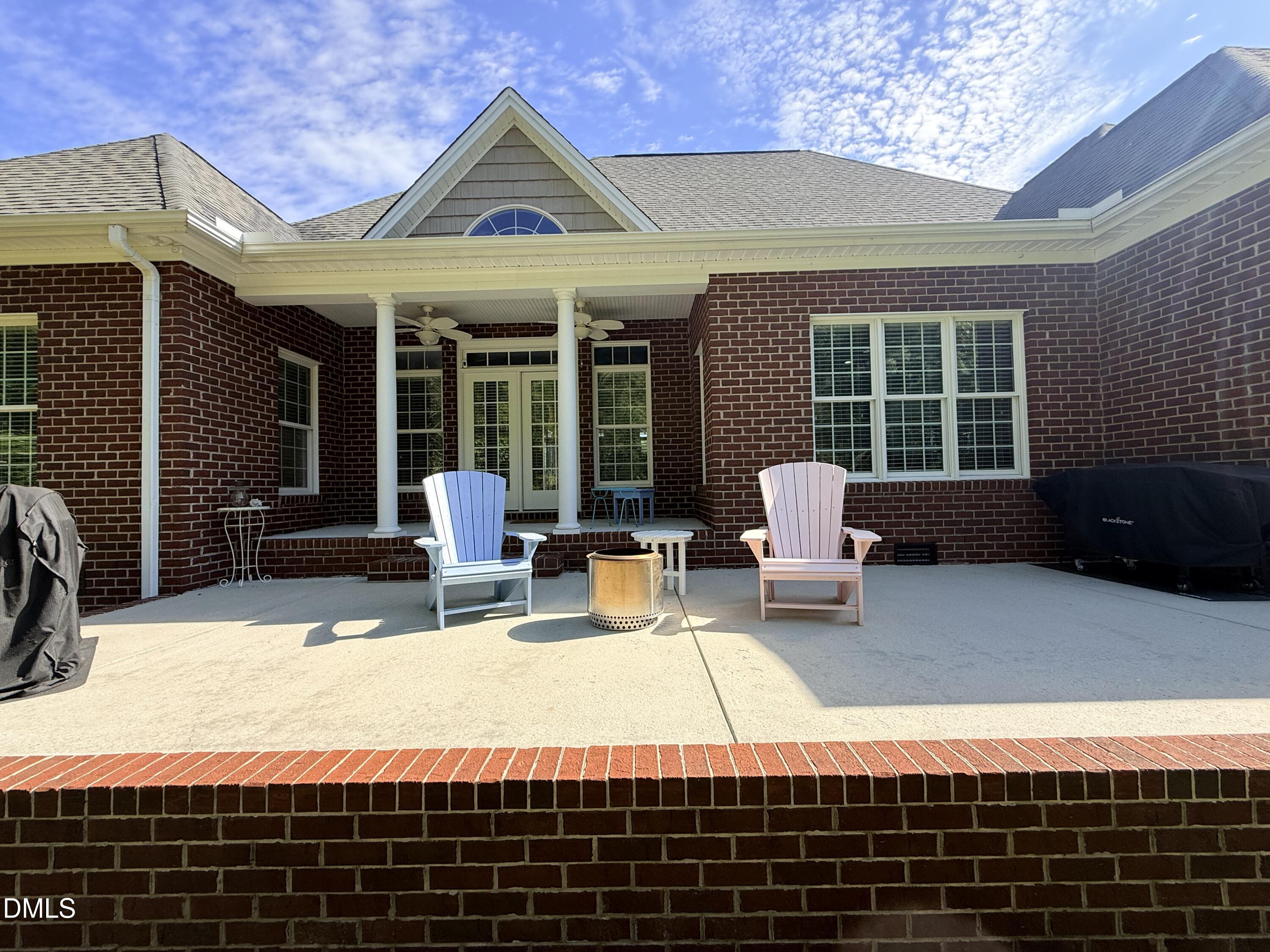 217 Clearwater Drive Roxboro, NC 27574 - Photo 53 of 57 a view of a patio with couches chairs and potted plants