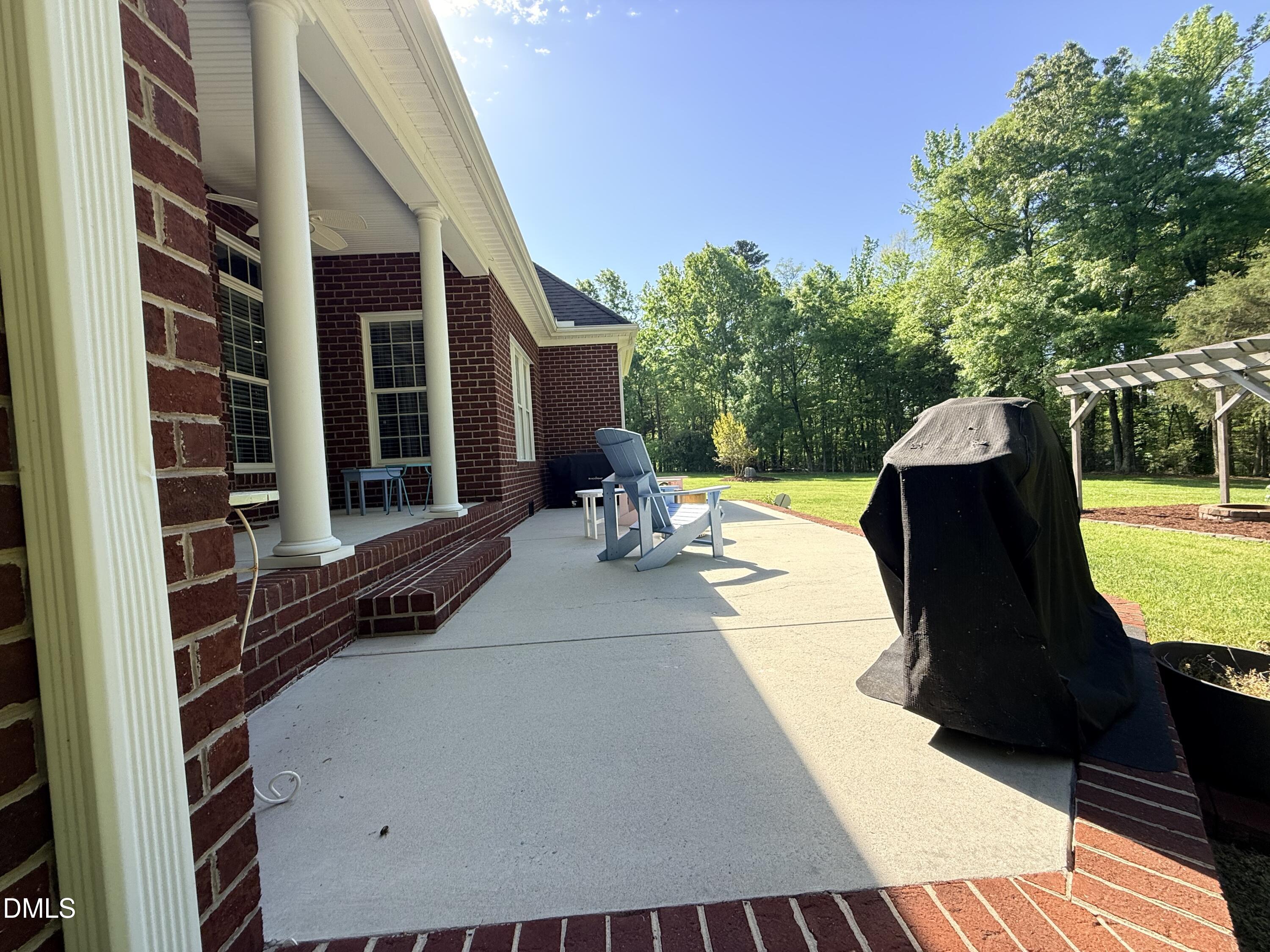 217 Clearwater Drive Roxboro, NC 27574 - Photo 54 of 57 a view of a patio with a table and chairs