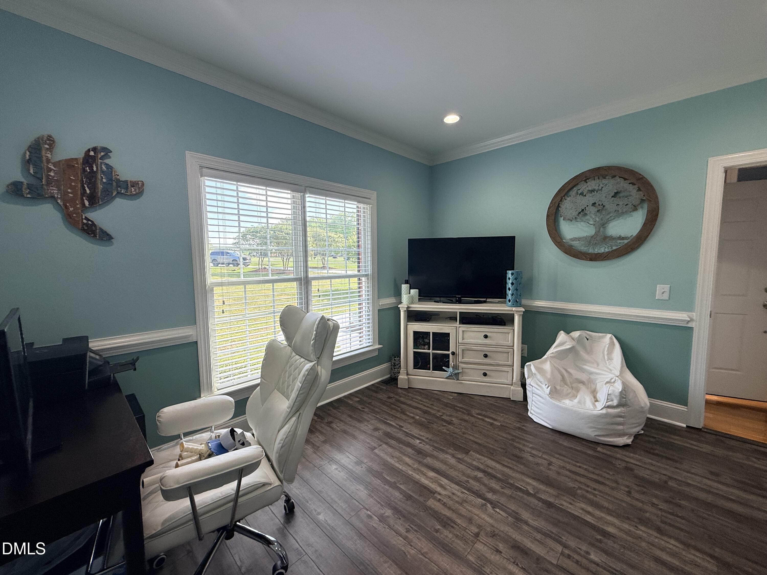 217 Clearwater Drive Roxboro, NC 27574 - Photo 10 of 57 a living room with furniture and a flat screen tv