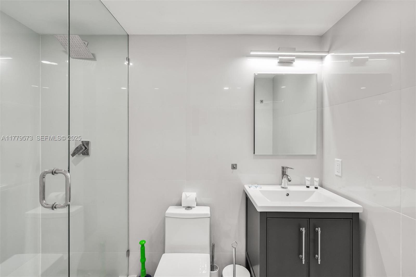 1630 Southwest 4th Avenue, Unit 2 Fort Lauderdale, FL 33315 - Photo 7 of 8 a bathroom with a sink toilet and shower