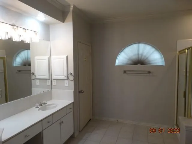 a bathroom with a double vanity sink mirror and double