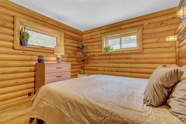 a view of a bedroom with a bed