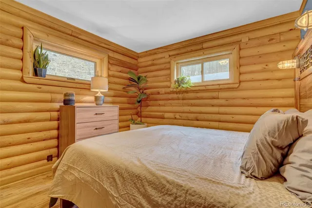 a view of a bedroom with a bed