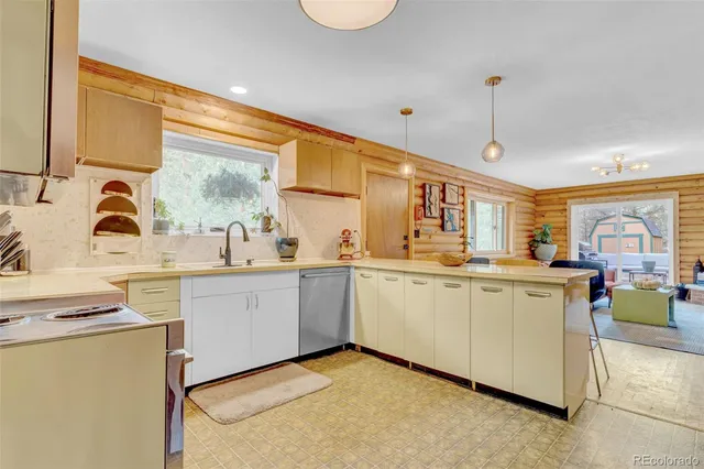 a kitchen with sink cabinets and window