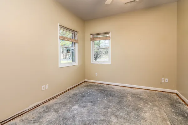 an empty room with a bathroom