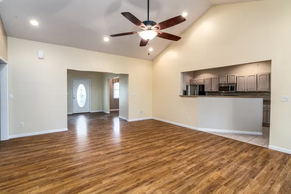 a kitchen with stainless steel appliances granite countertop a sink and a stove