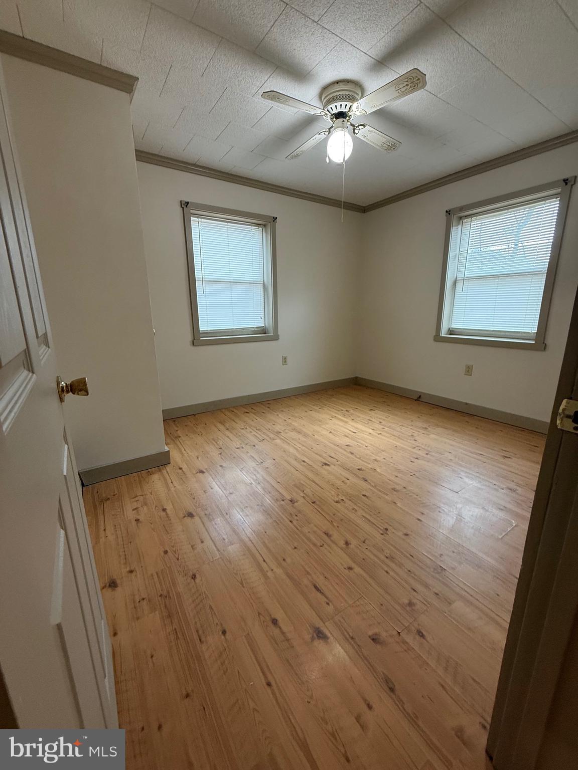 9505 Main Street Huntingdon, PA 16652 - Photo 13 of 72 an empty room with windows and fan