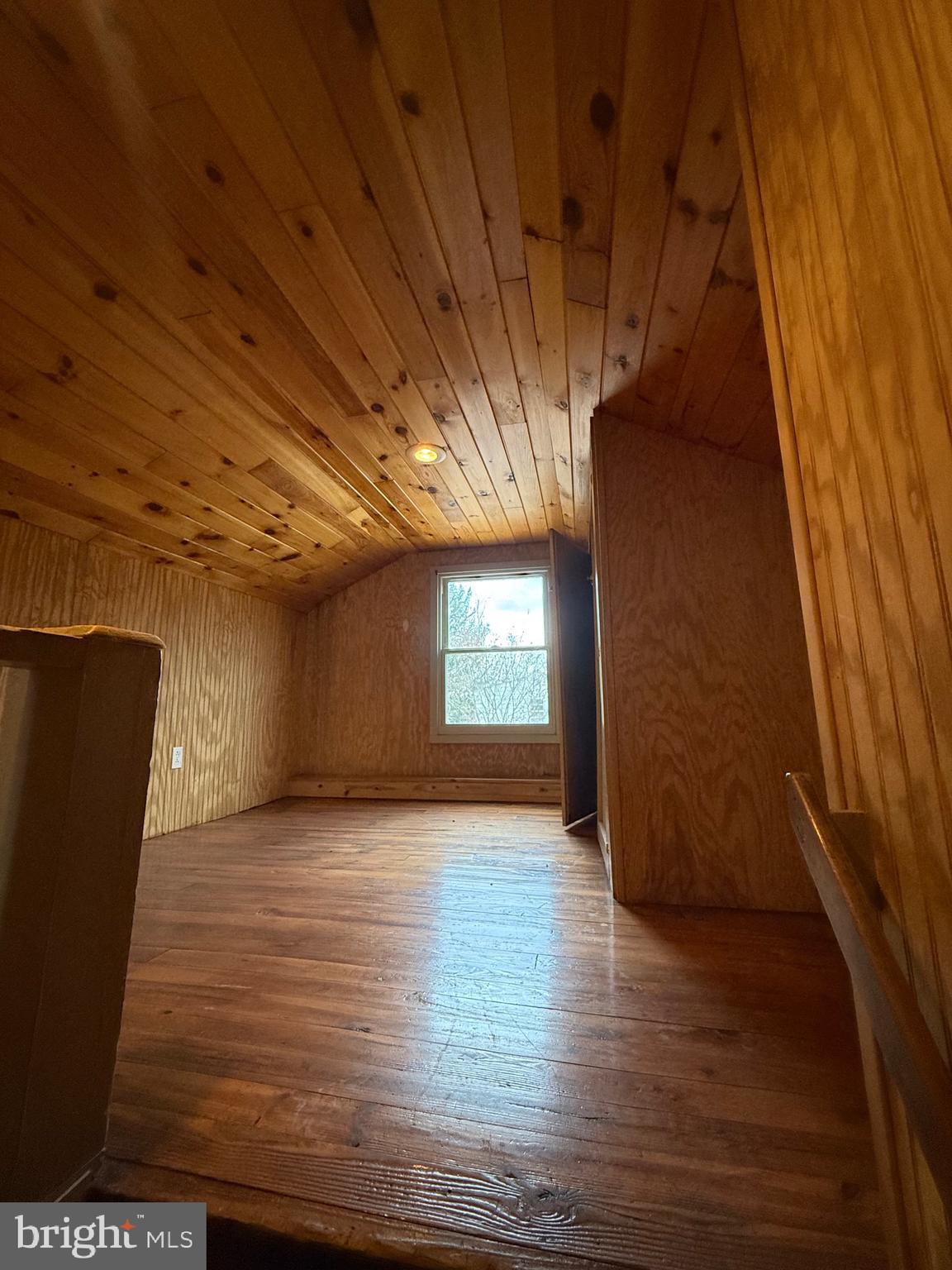 9505 Main Street Huntingdon, PA 16652 - Photo 26 of 72 a view of an empty room with wooden floor and a window