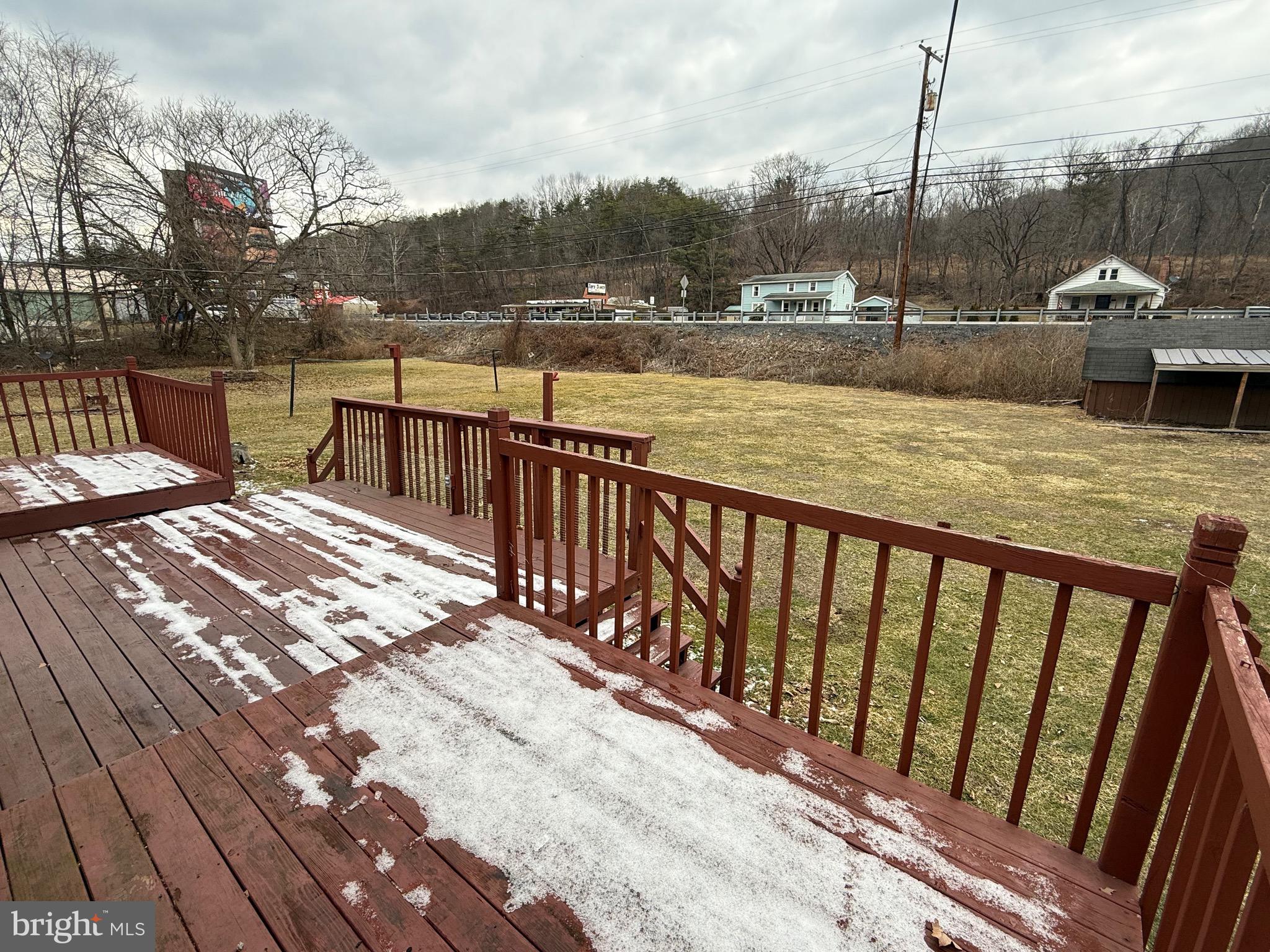9505 Main Street Huntingdon, PA 16652 - Photo 41 of 72 a view of a balcony with wooden floor and lake view