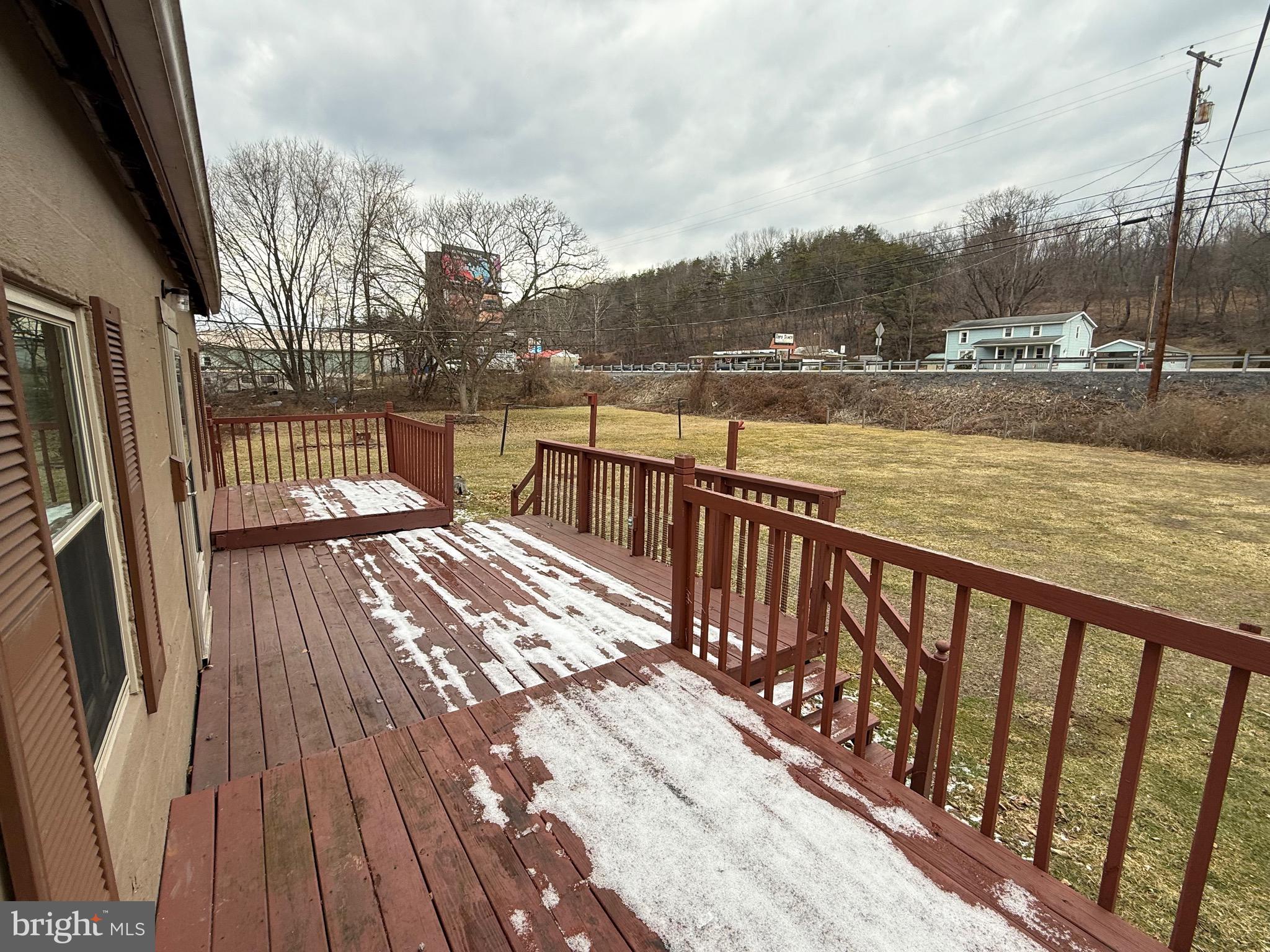 9505 Main Street Huntingdon, PA 16652 - Photo 42 of 72 a view of balcony with wooden floor and lake view
