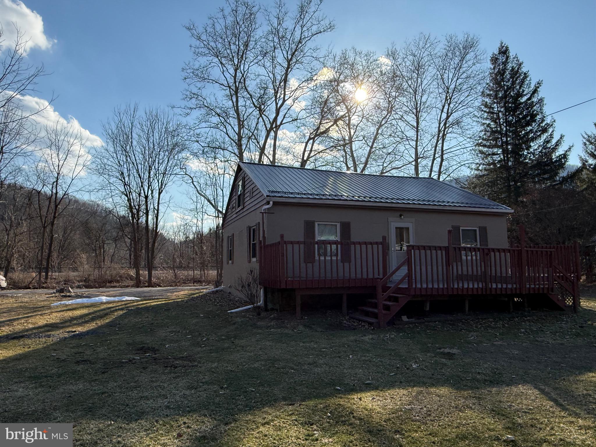 9505 Main Street Huntingdon, PA 16652 - Photo 70 of 72 a view of a house with a yard and a wooden deck