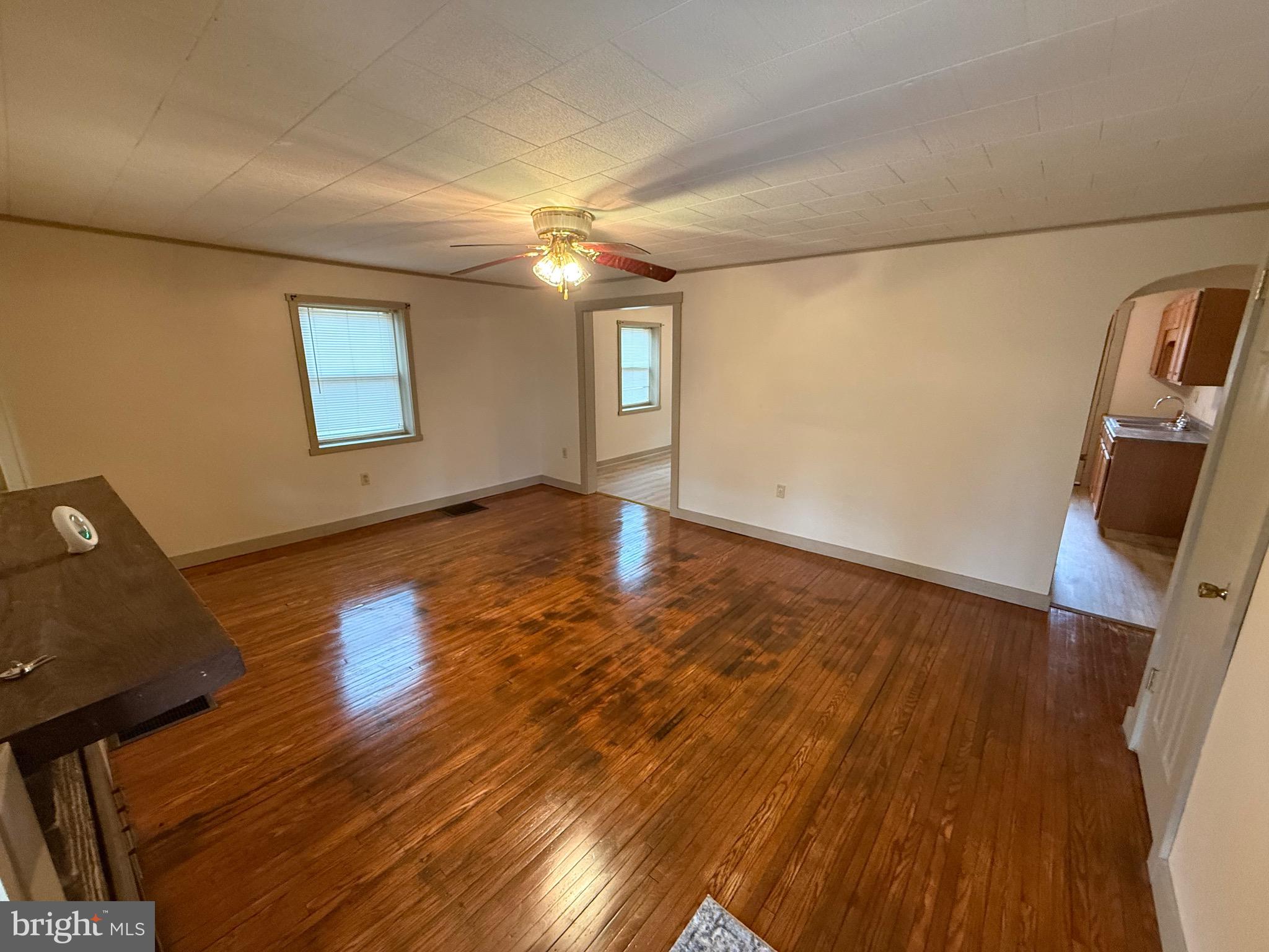 9505 Main Street Huntingdon, PA 16652 - Photo 9 of 72 wooden floor in an empty room with a window