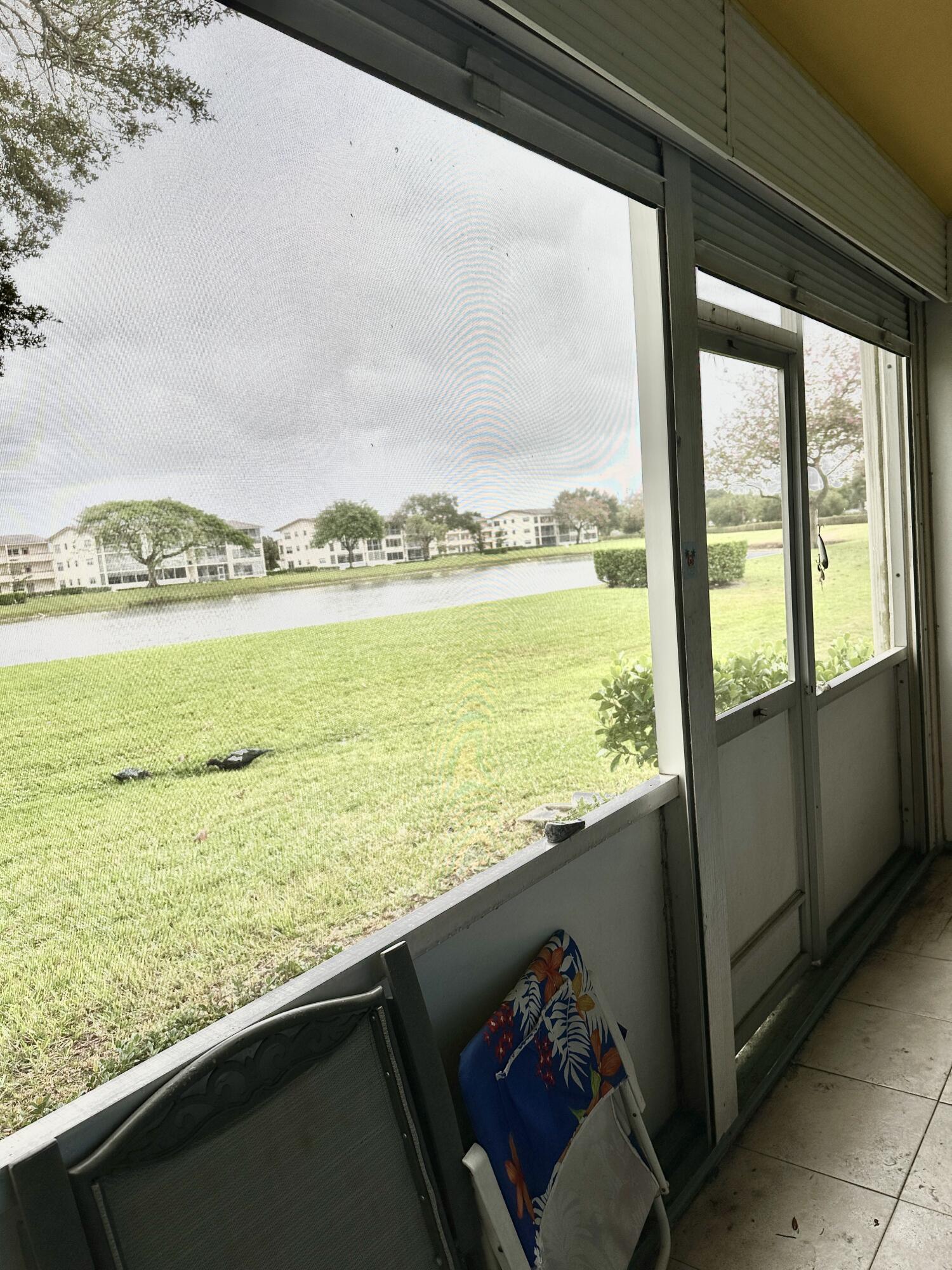 11 Preston A Boca Raton, FL 33434 - Photo 9 of 33 Screened patio w/ Lake View