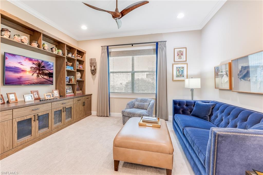 12749 Dundee Lane Naples, FL 34120 - Photo 13 of 45 a living room with furniture and a flat screen tv