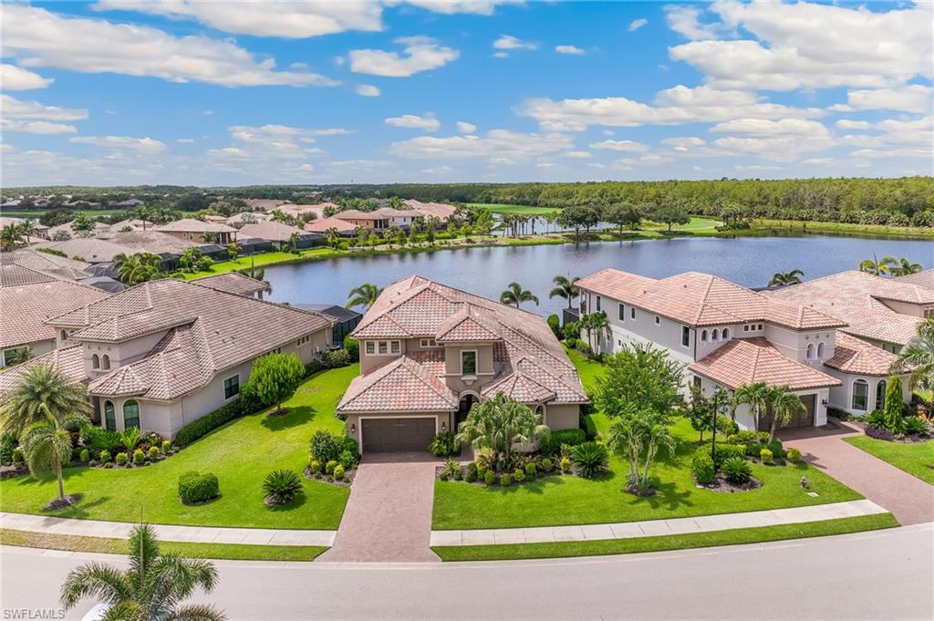 12749 Dundee Lane Naples, FL 34120 - Photo 3 of 45 an aerial view of house with yard and ocean view