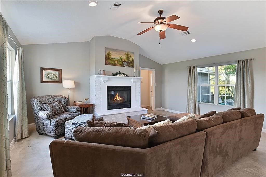 9776 Calhoun Road Bryan, TX 77808 - Photo 17 of 50 a living room with furniture and a fireplace