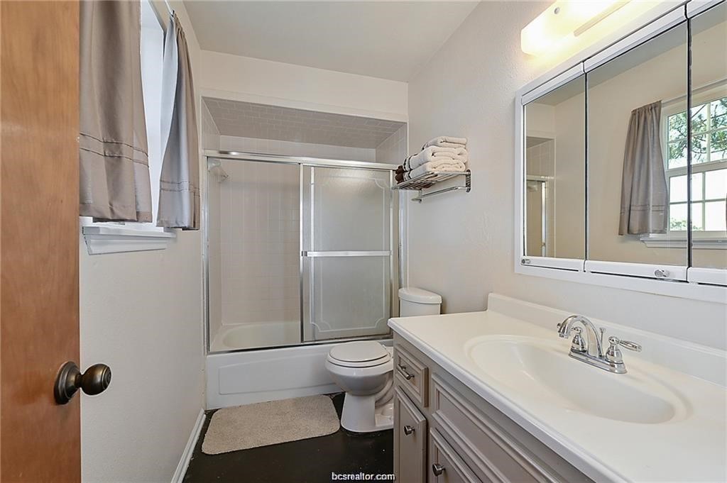 9776 Calhoun Road Bryan, TX 77808 - Photo 28 of 50 a bathroom with a sink a toilet and shower