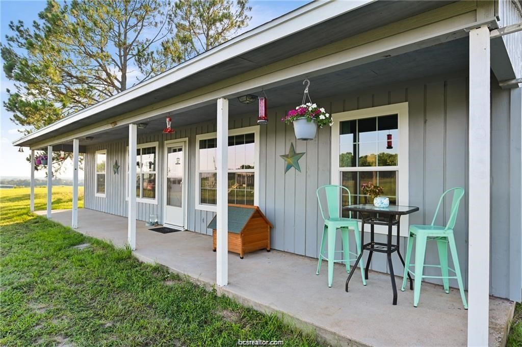 9776 Calhoun Road Bryan, TX 77808 - Photo 3 of 50 a front view of a house having patio