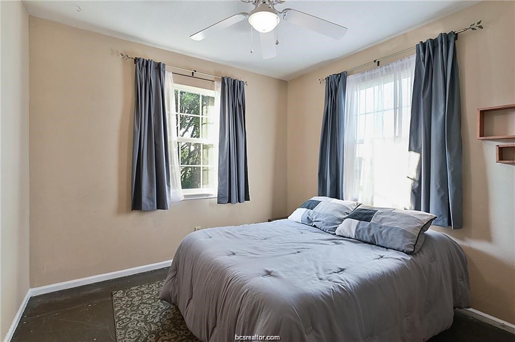 9776 Calhoun Road Bryan, TX 77808 - Photo 33 of 50 a bedroom with a bed and a window