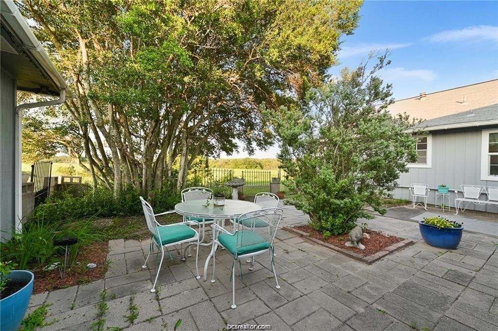 9776 Calhoun Road Bryan, TX 77808 - Photo 36 of 50 a chairs and table in a backyard