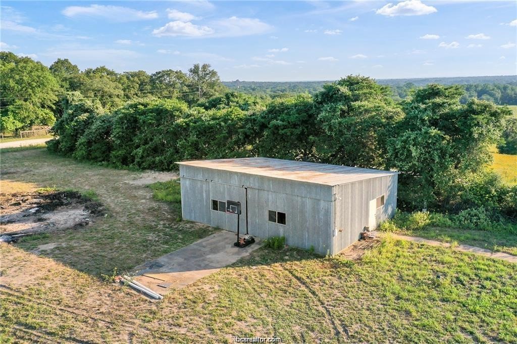 9776 Calhoun Road Bryan, TX 77808 - Photo 41 of 50 a view of a house with a yard