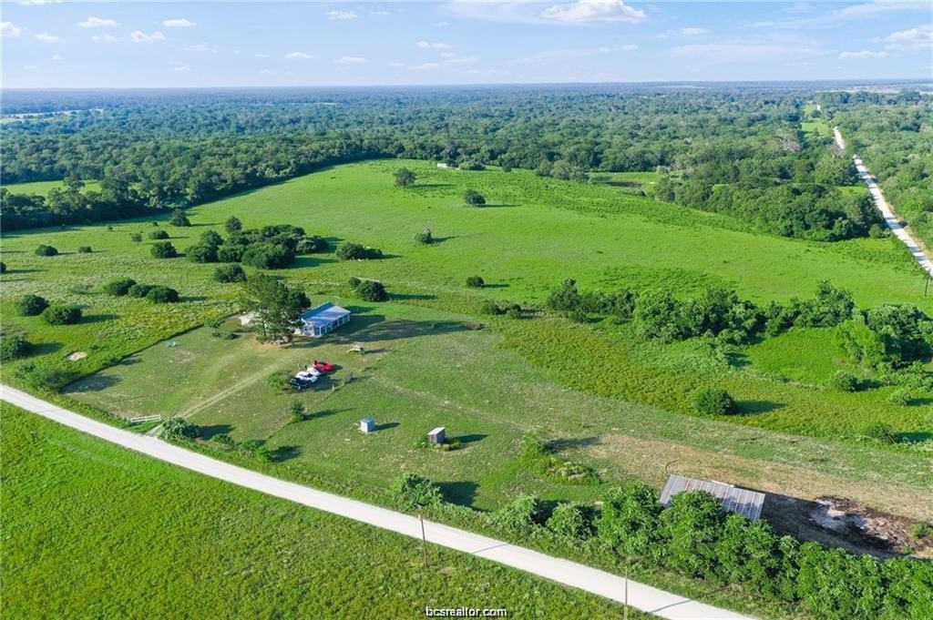 9776 Calhoun Road Bryan, TX 77808 - Photo 44 of 50 a view of a green field with a big yard