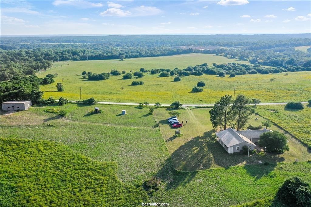 9776 Calhoun Road Bryan, TX 77808 - Photo 49 of 50 an aerial view of a houses with outdoor space