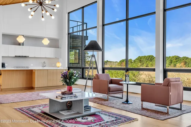 a view of gym equipment with wooden floor