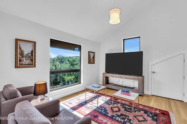 a view of a livingroom with furniture and a window
