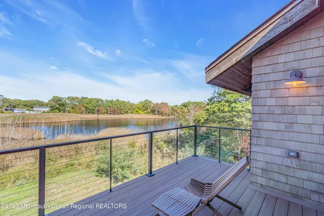 a bathroom with a double vanity sink a mirror and a bathtub
