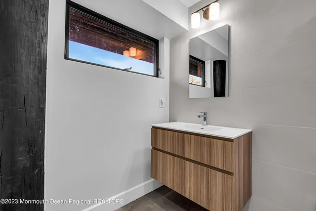 a view of a wooden deck with chairs and table