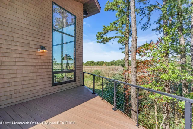 a view of a pathway of a house with backyard and garden