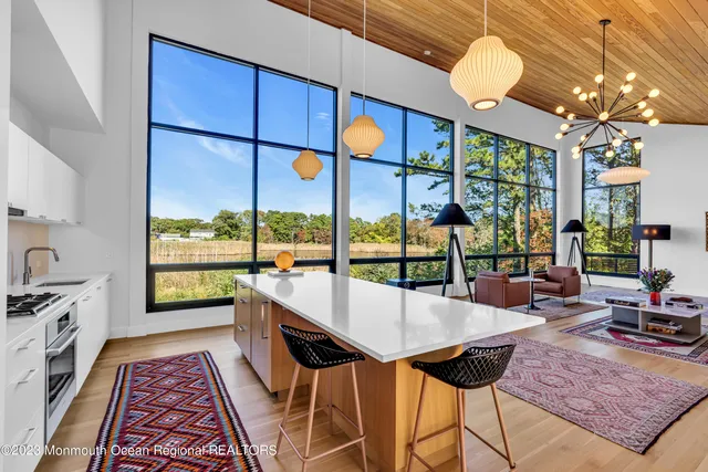 a kitchen with a sink a stove and cabinets
