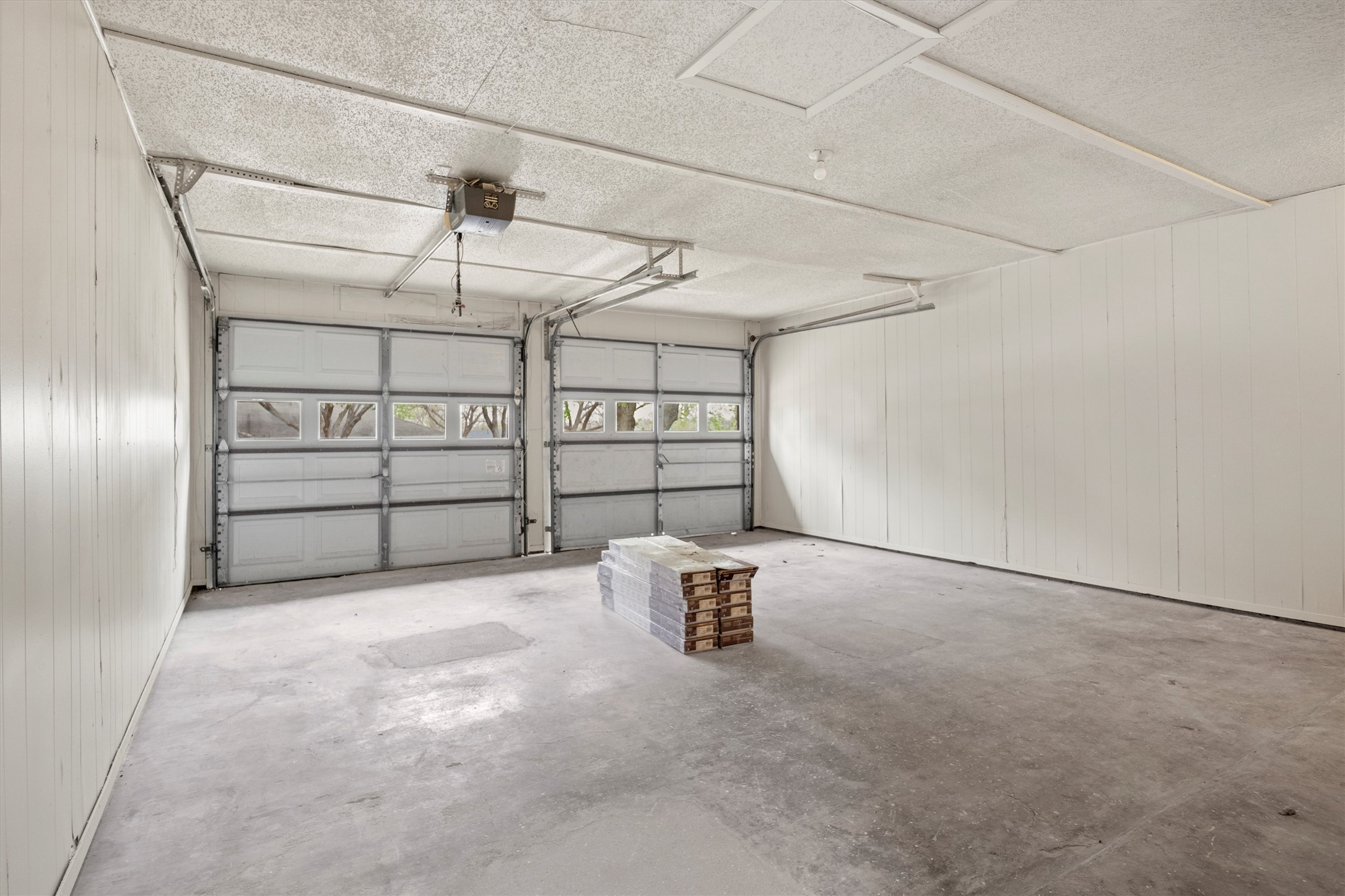 502 Pin Tail Lane Taylor, TX 76574 - Photo 6 of 26 Two overhead garage doors with frosted window panels